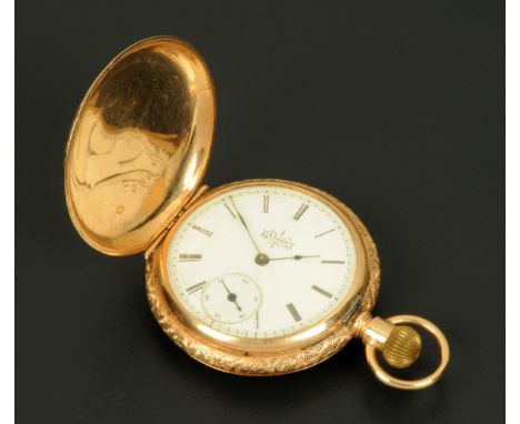 An Elgin Watch Co. full Hunter pocket watch, with foliate engraved case, knob wind, the case stamped "14 K" and with Roman nu