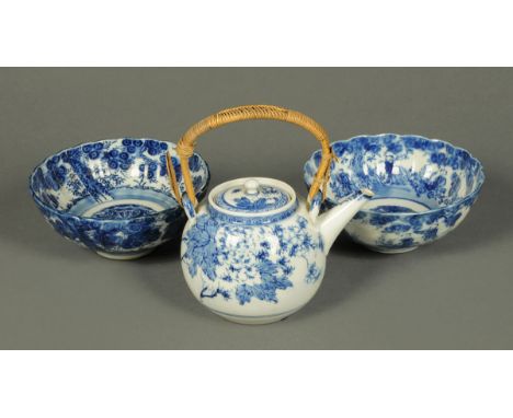 Two Japanese blue and white bowls and teapot with cane handle.  Vase height 34 cm. 