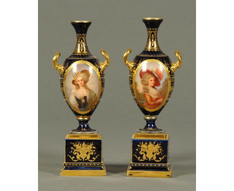 A pair of Vienna vases, decorated with portrait panels and signed "Kiel".  Height 22 cm.  CONDITION REPORT: Both vases have m