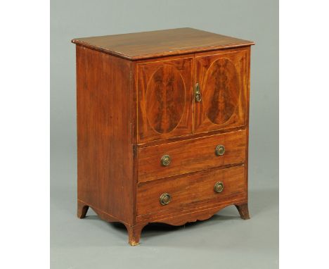 A George III mahogany commode, converted to a cupboard above two drawers with brass drop handles and all raised on splayed br