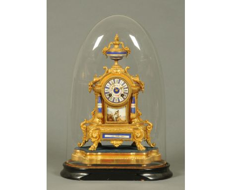 A Victorian spelter mantle clock, with Japy Freres two-train striking movement, raised on a wooden base and house under a gla