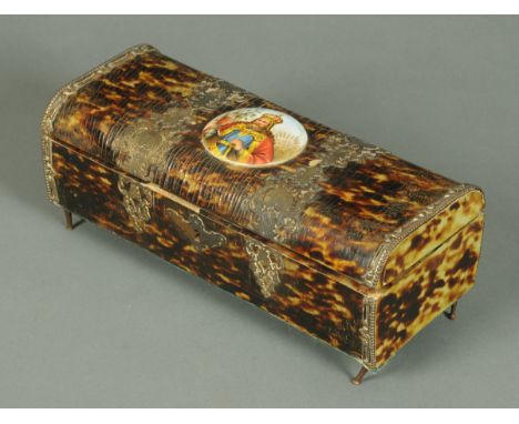 A 19th century tortoiseshell jewellery casket, with porcelain plaque and silver coloured metal mounts and with musical moveme
