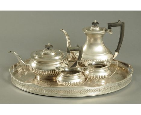 A silver plated four piece tea service, half lobed in the Queen Anne style, and a silver plated galleried oval tray on copper