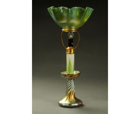 A Louis Comfort Tiffany Favrile candle lamp, circa 1910, part opal glass with green feather pattern, the base with petrol lus