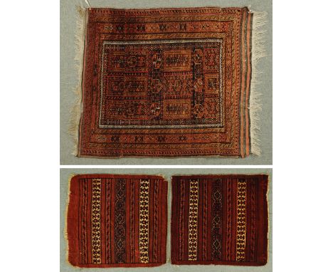 * A small Persian rug, with fringed ends, multiple fine line border and rectangular centre panel with repeating motif, and tw