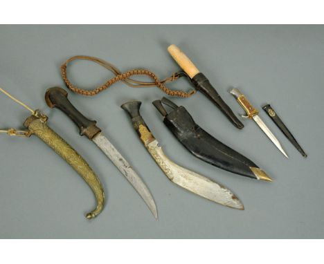 A Jambiya dagger, Kukri knife, hunting knife and small stag horn handled knife. 