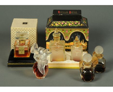 A collection of perfumes, each in glass flask, "Nina Ricci" with bottle made by Lalique, France, boxed Russian set of two per