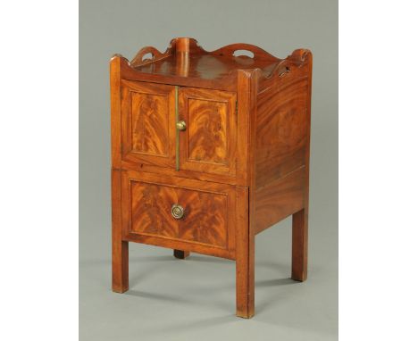 A George III mahogany tray topped commode, with pair of doors above a sliding front modelled as a drawer and complete with li