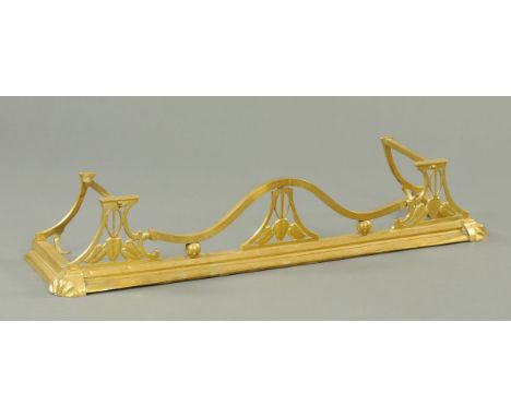 An Arts & Crafts brass fender.  External dimension 136 cm.