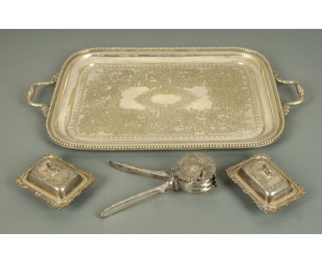 A late Victorian electroplated two handled serving tray, a scissor action lemon squeezer and pair of late Victorian miniature