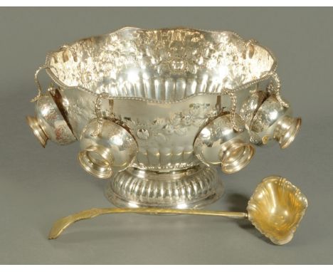 A silver plated punch bowl with ladle and cups. CONDITION REPORT: This punch bowl is silver plated and not silver.  There are