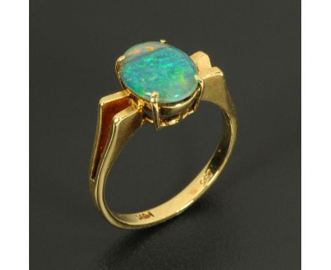 A 14 ct gold and black opal ring, size M (see illustration).