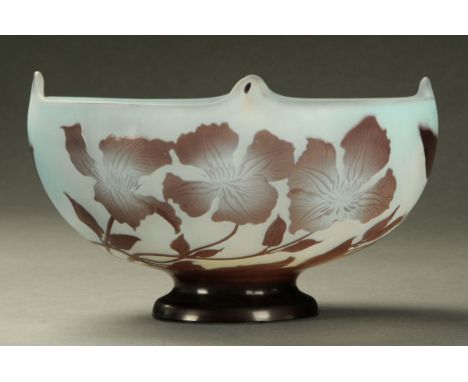 An Emile Galle cameo glass bowl, circa 1906-14, purple overlay clematis against a light blue ground, signed "Galle".  Diamete