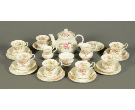 A Royal Albert Moss Rose tea set, teapot, milk jug, six plates, eight saucers, sugar basin, seven cups, cream jug.  