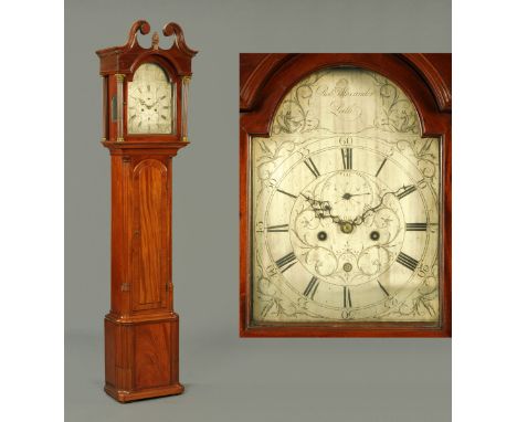 A George III mahogany cased longcase clock, with swans neck pediment above the arched glazed door enclosing a silvered brass 