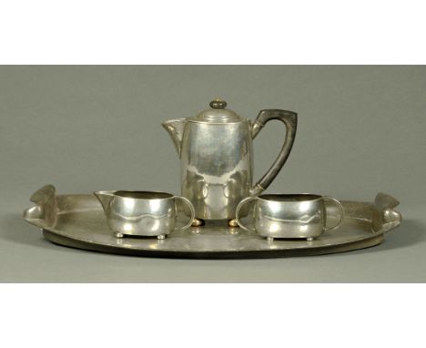 A Tudric pewter tea service, three pieces and with tray, for Liberty & Co.