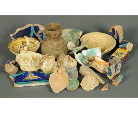 * A collection of archaeological tile and bowl fragments.