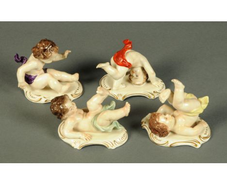 Four German porcelain cherub figurines, with sceptre over K blue mark to base.  Tallest 9 cm. 