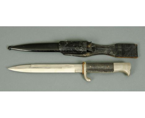 A World War II German dress bayonet, with scabbard and frog.