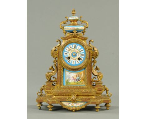 A 19th century spelter and porcelain panelled mantle clock, French, circa 1880.  Height 35 cm, width 27.5 cm.