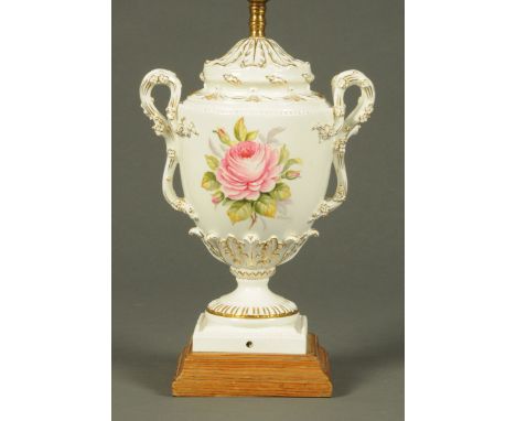 A Royal Worcester lamp, painted with roses, signed "E. Townsend" and raised on a wooden plinth.  Height including light fitti