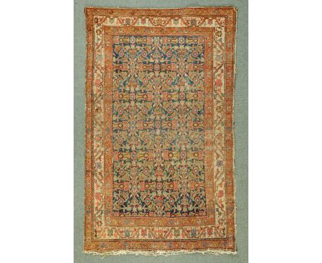 * A Ferahan rug, with profusely decorated centre rectangular panel and multiple line border.  134 cm x 202 cm. 