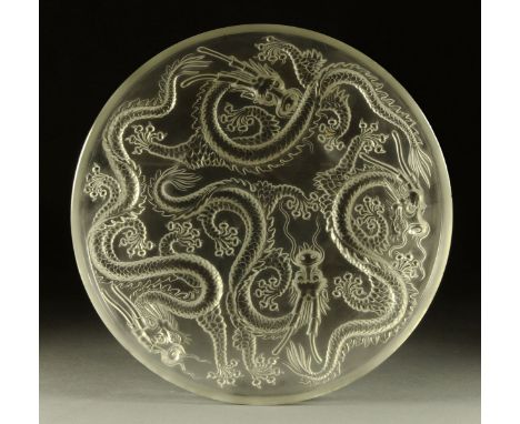 An Art Deco glass bowl or light shade, decorated in relief with dragons in the Lalique style.  Diameter 35.5 cm.  CONDITION R