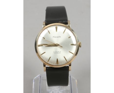 A gentlemans 9ct gold Nivada manual wristwatch with satin dial, baton markers and centre seconds. Condition Report. To be use