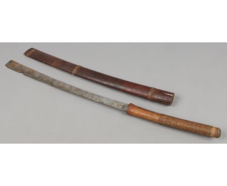 A World War II Burmese Husa Dha sword in wooden scabbard.