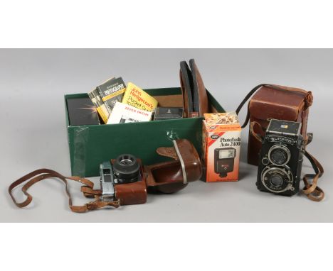 A collection of photographic leather cased Superb Voitlander T.L.R camera, German Calora 35 SLR Kodak Disk 2000 Kodak Instama