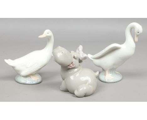 A Nao figure of a hippo along with two Nao figures of ducks.