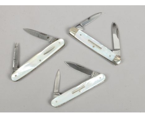 Three folding pen knives with mother of pearl scales.