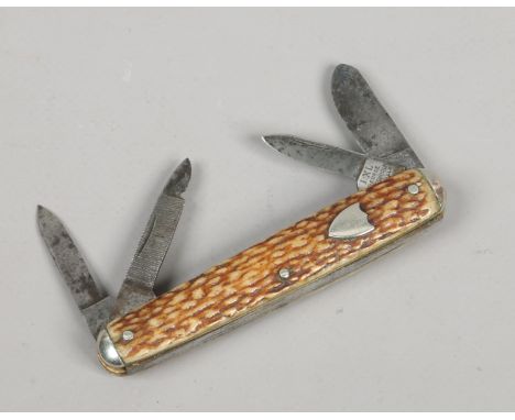 A multi tool folding pocket knife by George Wostenholm Sheffield with antler scales having shield cartouche.