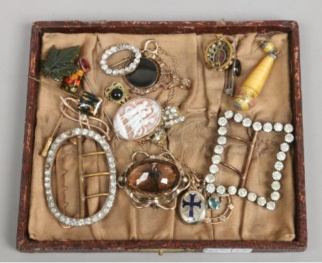 A tray of vintage dress jewellery including pinchbeck and smokey quartz brooch, cameo and stick pins etc.
