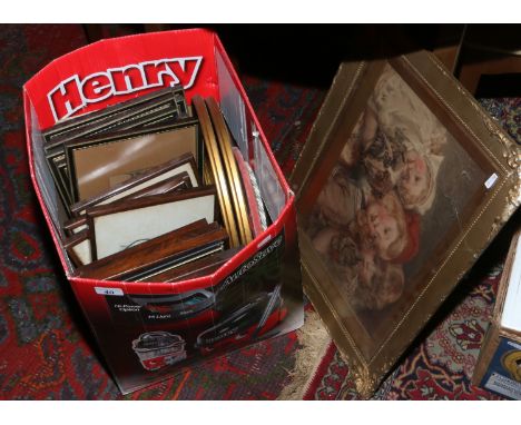 A gilt framed Seymour Lucas print, along with a box of pictures and prints.