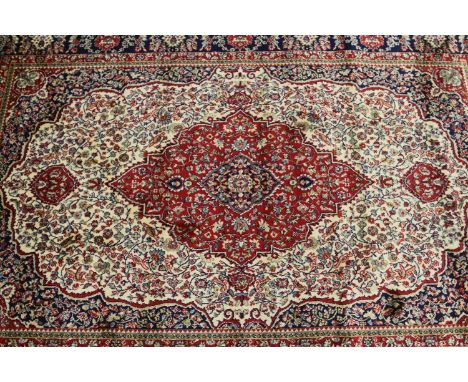 An ivory ground Cashmere traditional medallion design carpet square, 176 x 110.7cm.