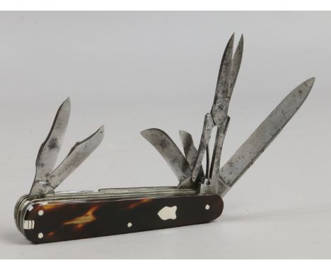 A 19th century multi tool folding pocket knife with tortoise shell scales, 11 accoutrements.