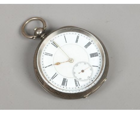 A continental silver cased pocket watch with white enamel dial, second subsidiary dial and Roman numeral markers.