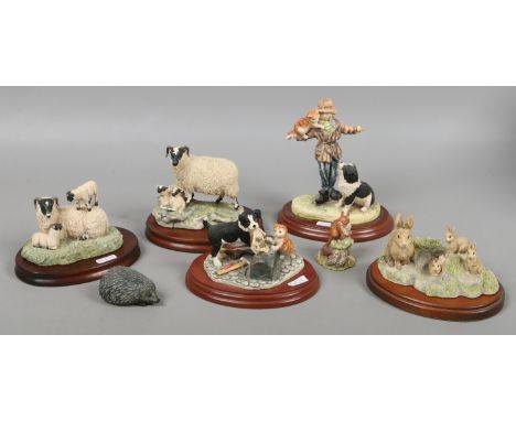 A quantity of ceramic figural groups including Border Fine Arts examples depicting border collie pups, sheep etc. Condition R