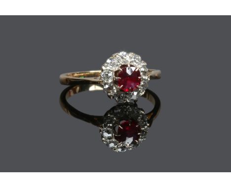 An 18ct gold ruby and diamond coronet cluster ring, size K. Condition Report. To be used as a guide only. Good condition. 