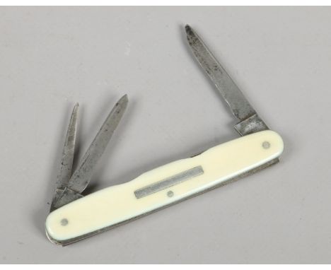 A multi tool folding pocket knife by Cowley Sheffield. With ivory scales.