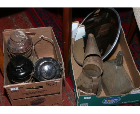 Two boxes of metalwares including three hurricane lanterns, a guttering hopper, convex driveway mirror etc.