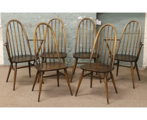 A set of six Ercol Quaker style dining chairs including two carvers. Condition Report. To be used as a guide only. Minor wear