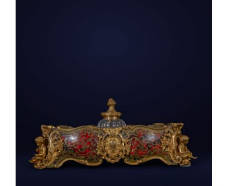 Elegant Rococo style inkwell, adorned with intricate gilded details and floral motifs. The body of the inkwell is embellished