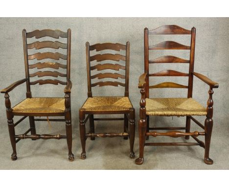 A 19th century mahogany ladder back open arm chair together with a matching single chair and a 19th century ladder back chair