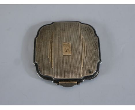 An Art Deco engine turned hallmarked silver ladies compact. H.0.5 W.8 D.7.5cm. 105g gross weight 