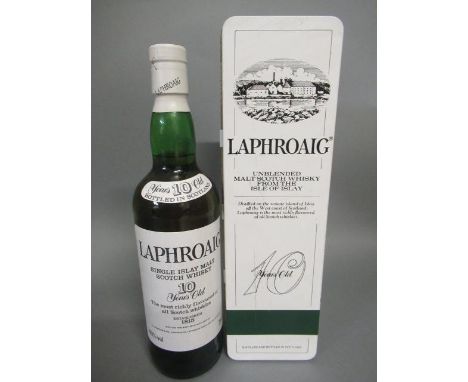 One bottle Laphroaig 10 year old unblended malt scotch whisky, in tin (Est. plus 21% premium inc. VAT)mild oxidation to tin