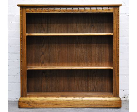 Ercol open bookcase, with two adjustable shelves on a plinth base, height 96cm, width 96cm, depth 33cm.