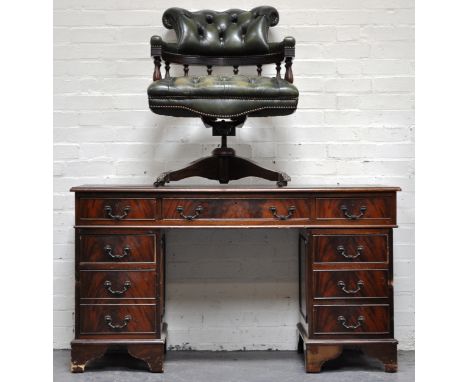 Mahogany twin pedestal nine drawer desk, green leather insert and a swivel office chair, green leather button back upholstery