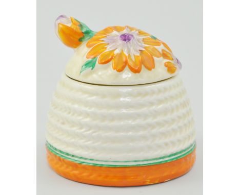 Clarice Cliff Marguerite beehive honey pot, relief moulded and decorated in orange, green and purple, Bizarre, Newport marks 
